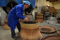 ANHUI PROVINCE, CHINA Ã¢â¬â CIRCA OCTOBER 2017: A man working inside a tea factory Royalty Free Stock Photo